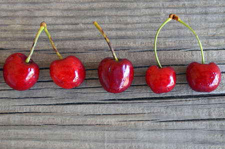Fresh organic cherries berries on old wooden background.Selective focus.の写真素材