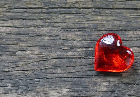 Decorative red heart on wooden background.Valentine heart.Saint Valentine's Day or Love concept.Selective focus.の写真素材