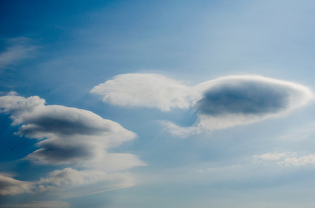blue sky in white clouds, dramatic clouds on a bright blue sky