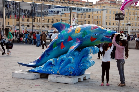 Statue of bright colourful dolphine in Marseilles, Franceのeditorial素材