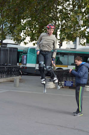 Young jolly jumper learns to do the exercises on the athletic fieldのeditorial素材