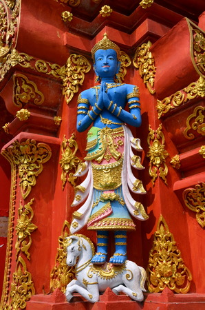 Buddha sculpture on the facade of the temple; Chiang Mai, Thailand 