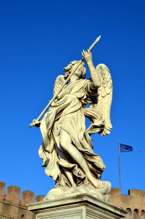 Sculpture of an angel with spear on Ponte Sant Angelo, Rome, Italy. The bridge was built in 1450の写真素材