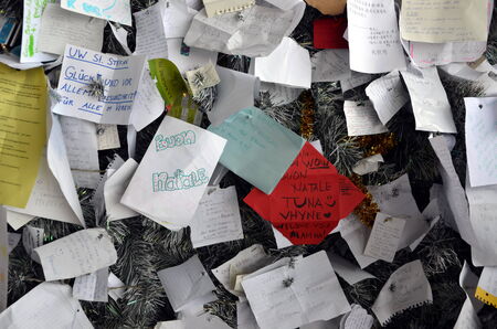 Notes with wishes and requests to Santa Claus on Christmas tree in Rome, Italyのeditorial素材