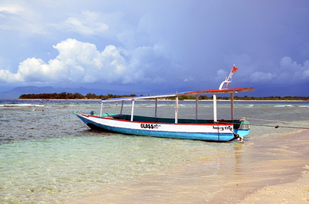 Small glass bottom boat on the island Gili Trawangan in Indonesiaのeditorial素材