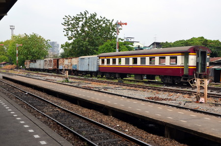 Old railroad cars on the rails in Thonburi railway station. Bangkok, Thailandのeditorial素材