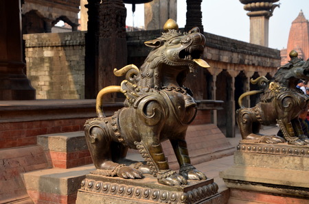 Statues of guarding  lions in Bhaktapur Durbar Square. Bhaktapur  is an ancient Newar city in the east corner of the Kathmandu Valley, Nepalの写真素材