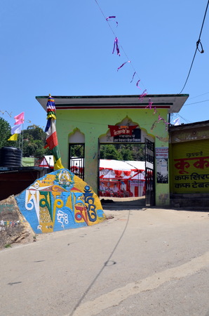 REWALSAR, INDIA - APRIL 15, 2013: Gate to Buddhist monastery in Rewalsar city, India. Stone with Om mani padme hum mantraのeditorial素材