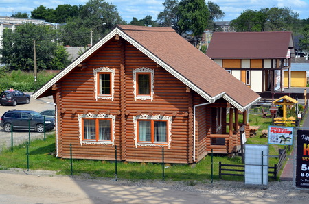 VOLOGDA, RUSSIA - JUNE 21, 2013: Vologda settlement or Vologda Sloboda - an exhibition and sale of country houses. New wooden houses for saleのeditorial素材