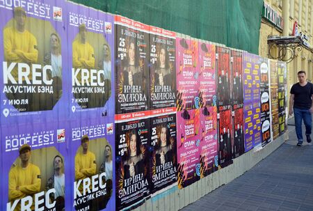 SAINT-PETERSBURG, RUSSIA - JUNE 28, 2019 - Posters on the wall in St. Petersburg, Russiaのeditorial素材