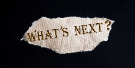 What's next The text is written on torn brown paperの写真素材