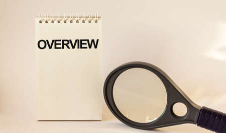 Review, the text is written on the calendar, near a magnifying glass on a white background.
