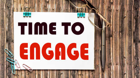 Phrase TIME TO ENGAGE wooden background, topの写真素材
