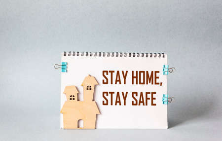 Notepad with the words Stay Home Stay SAFE, prevention conceptの写真素材