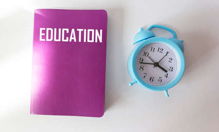 The word special education is written on a notepad and a white background with an alarm clock. Education conceptの写真素材