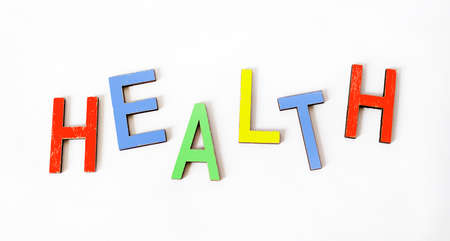 The word HEALTHY is written in color letters and a white background. Concept, spirit, body and mind,