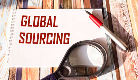 The Global Sourcing text is written on a notepad. Business concept for the practice of searching the global market for goodsの写真素材
