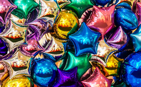 many colorful balloons and air stars forming a bright background, for your desktopの写真素材