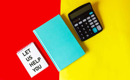 Notepad with text Let us help you on a red and yellow background with a calculator and a green...