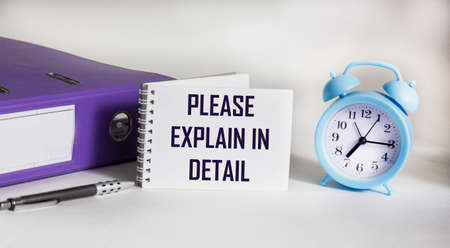 A sign with the inscription PLEASE EXPLAIN IN DETAIL on the table with document folder, alarm clock...