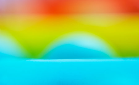 Blurry multicolored defocused colors. Rainbow effect .Festive backgroundの写真素材
