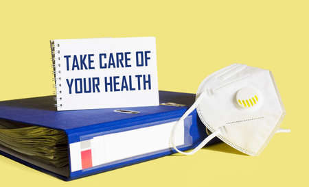 Notepad with the inscription CARE FOR YOUR HEALTH. Medical concept.