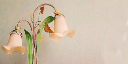 Two lamps in the form of flowers on a light background, vintage effect styleの写真素材