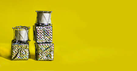 Gift silver boxes on a yellow background. colorful box of gifts.
