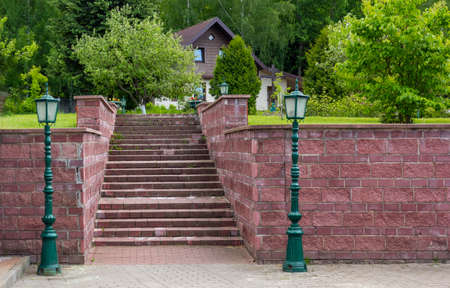 Staircase with beautiful lanterns in a summer city park. Europe.の写真素材
