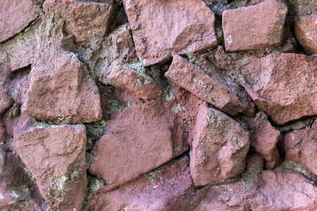 close-up bunch of red-pink stones soft focus natural red-brown background.の写真素材