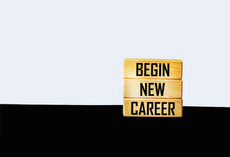 BEGIN A NEW CAREER text on wooden blocks on white and black backgroundの写真素材