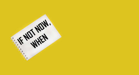 IF NOT NOW WHEN text on notepad and yellow background.Positive affirmations concept. Motivational concept with handwritten text.の写真素材