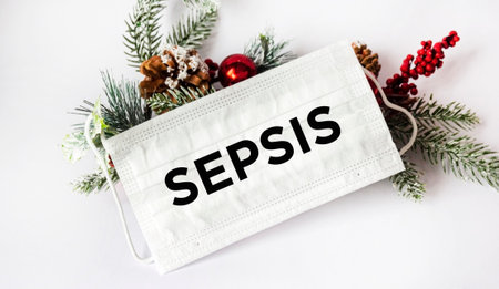 On a white background, stethoscope and medical mask with the text SEPSIS. New Year's thread. Medical...