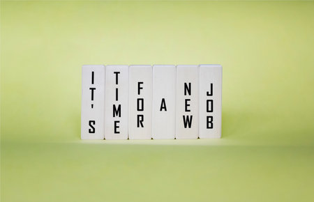 Text sign on wooden blocks indicating it's time for a new jobの写真素材
