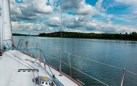 Photo from a snow-white yacht on a lake in clear weather