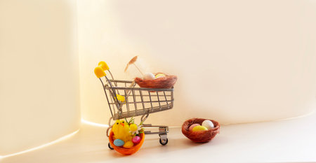 Colorful Easter eggs in a basket on a light background. Have a good Easter. A place to copy.