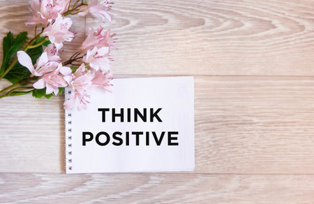 Think positively text on a beautiful background and with colorsの写真素材