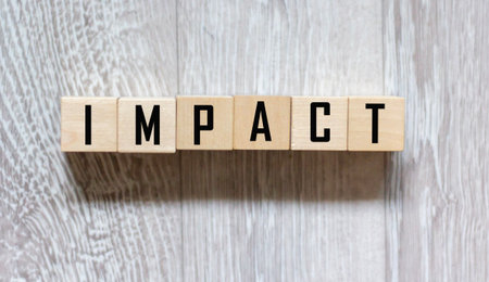 impact is a name made of wooden letters. Office deskの写真素材