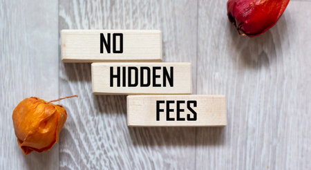 A symbol With no hidden fees. A concept word With no hidden fees on wooden blocks.の写真素材