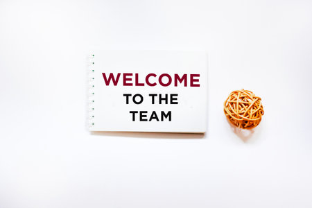 A notebook with the inscription welcome to the team. the concept of hiring new employees. the...