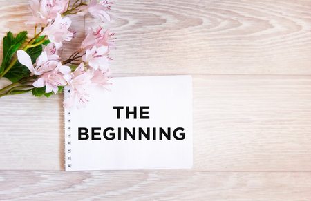 The BEGINNING text is written on a notebookの写真素材