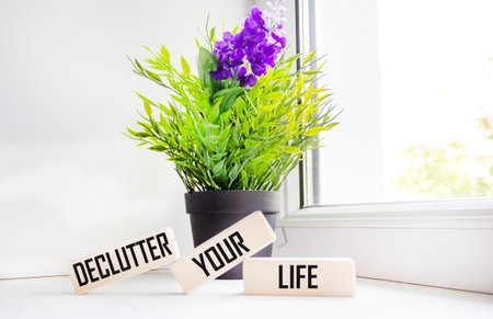 Wooden blocks with words 'Declutter your life'.