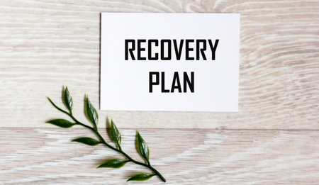 Notepad with a text recovery plan on a light backgroundの写真素材