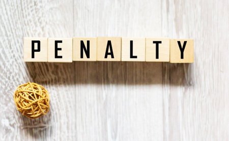 The word FINE is written on wooden blocks and a gray backgroundの写真素材