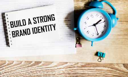 There is an inscription on the notebook Build a strong brand identityの写真素材