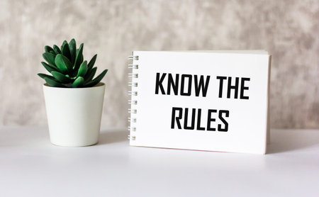A paper note with the text Know the rules