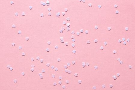 Little cute hearts on a pink background. Little tender hearts for Valentines Day and Women's Day...