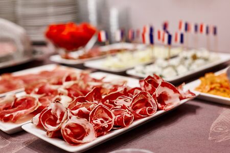 Beautifully designed buffet in the hotel restaurant with carefully thinly sliced meat, cheese and...