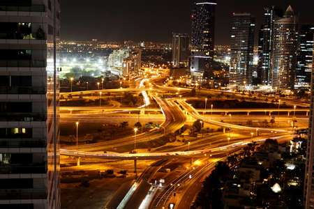 Dubai, UAE, November 2019 Night view of a road junction with moving cars against the lights of a modern cityのeditorial素材