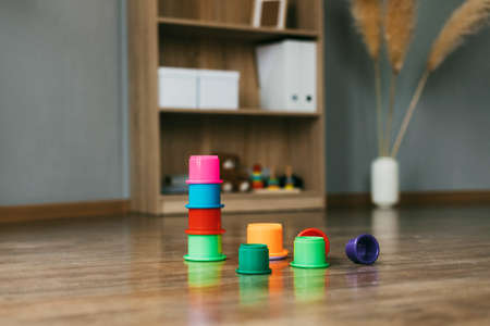 On the floor of the house or in the kindergarten there are colorful educational toysの写真素材